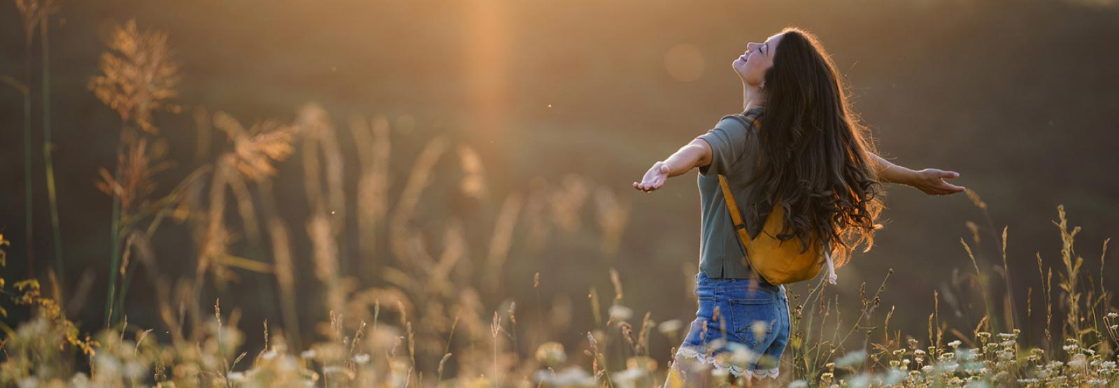 A young lady spending time in an open field